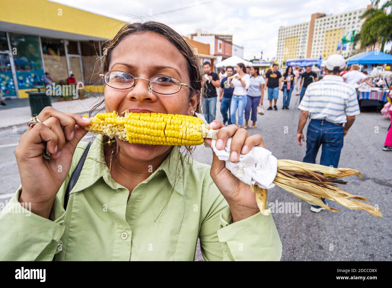 Miami Florida,Springs River Festival fair Hispanic woman female eating corn on cob, Stock Photo