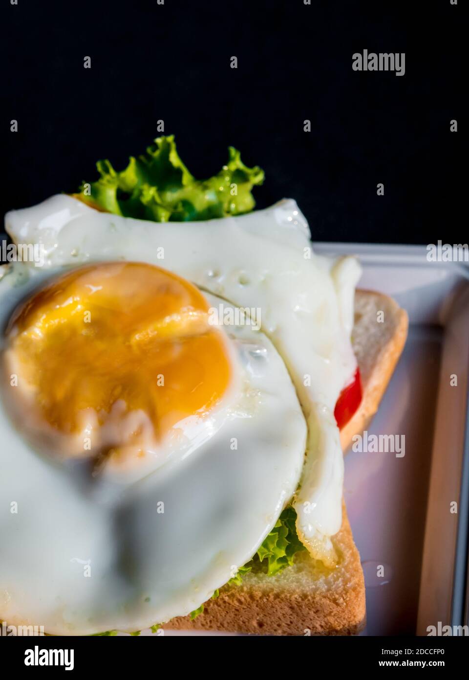 Fried egg and vegetable on sandwich bread Stock Photo - Alamy