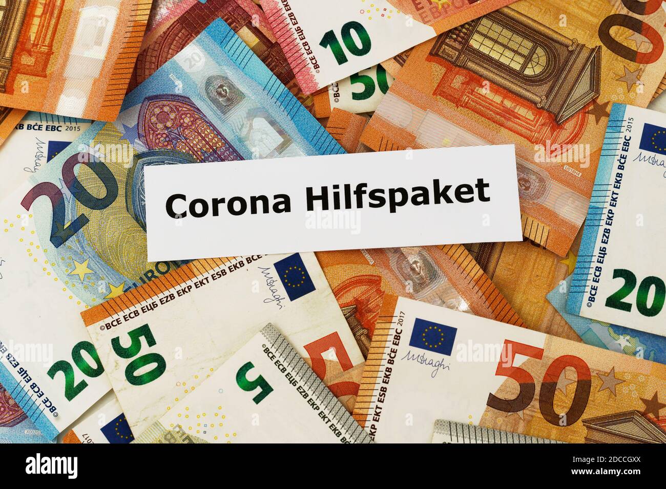 Mainz, Germany - November 20, 2020: Because of the corona pandemic, the German state has to support the economy with financial aids - a piece of paper Stock Photo