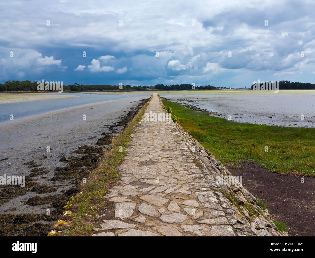 Causeway on the estuary of the Pont L'Abbe river in Finistere Brittany north west France. Stock Photo