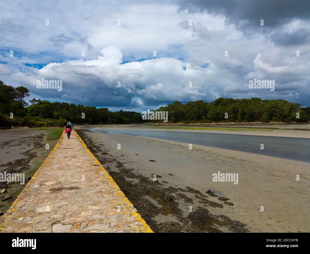 Causeway on the estuary of the Pont L'Abbe river in Finistere Brittany north west France. Stock Photo