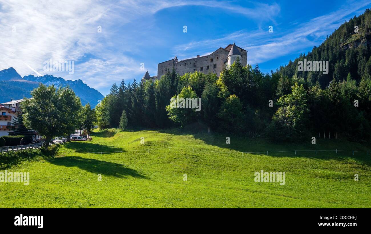 Nauders, Austria - September 14, 2019: On a hill south of Nauders (Tyrol, Austria) 12th century castle Naudersberg rises.  It is enthroned on a hill. Stock Photo
