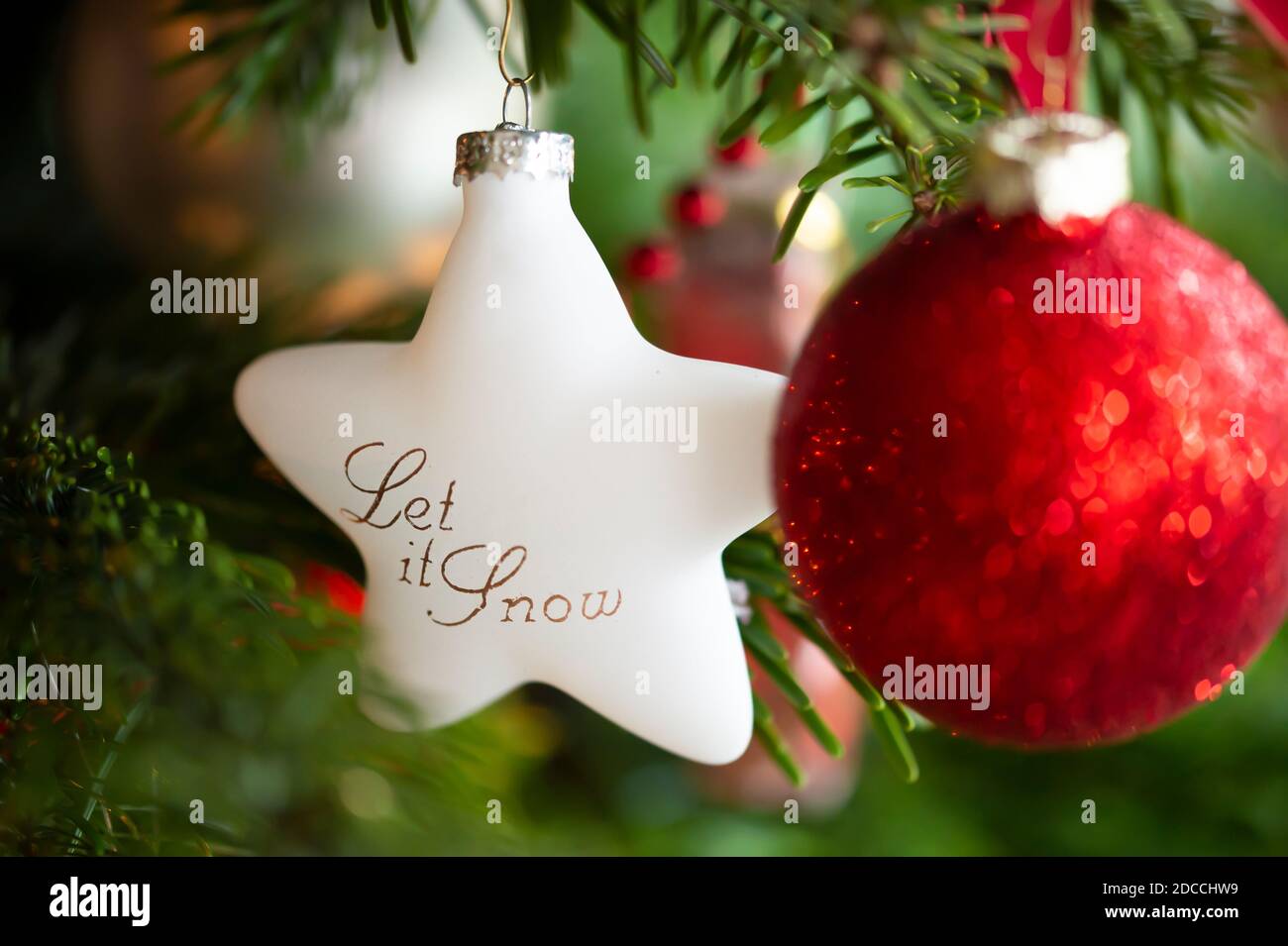 Decorated Christmas tree, real Nordmann fir in front of blurred