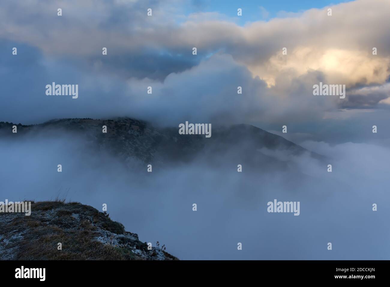 Atmospheric landscape with huge clouds over the mountain. Dramatic skies enveloped the mountains. Sad autumn landscape before the rain. Crimean nature Stock Photo