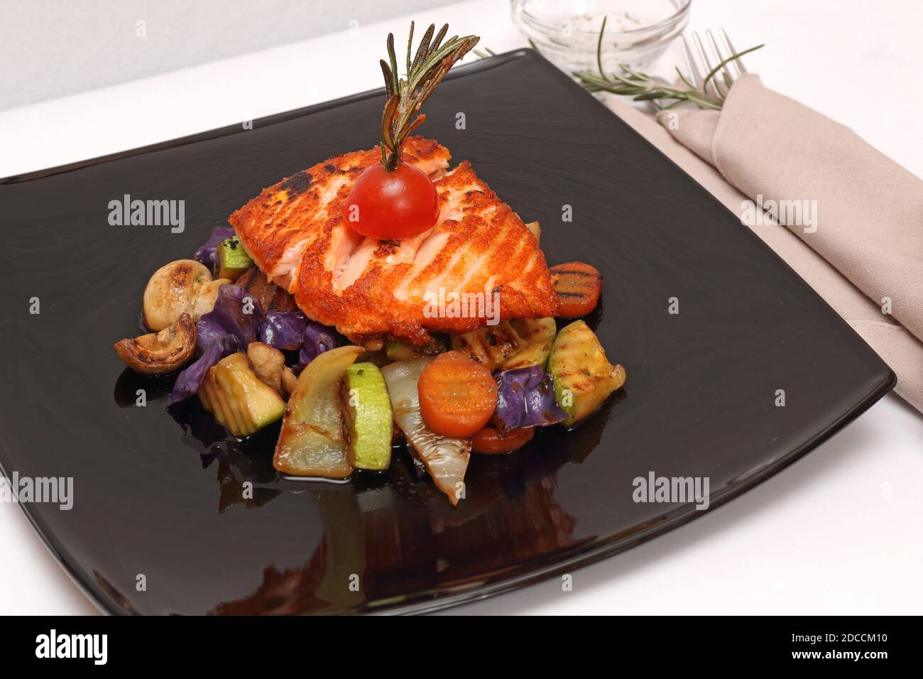Grilled Salmon Fillet With Vegetables Served on Black Plate Stock Photo ...