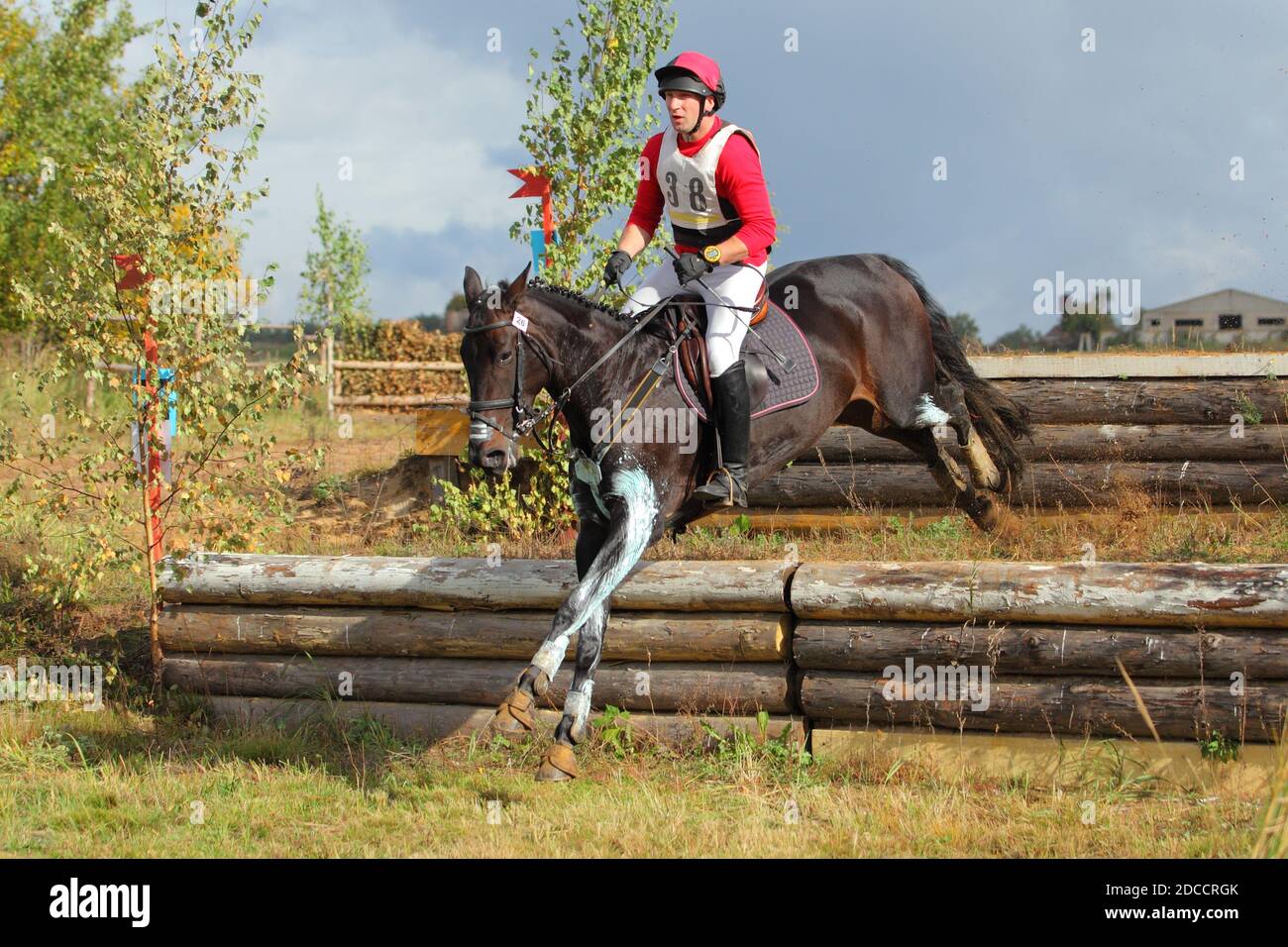 Horse and rider jumping cross country Stock Photo