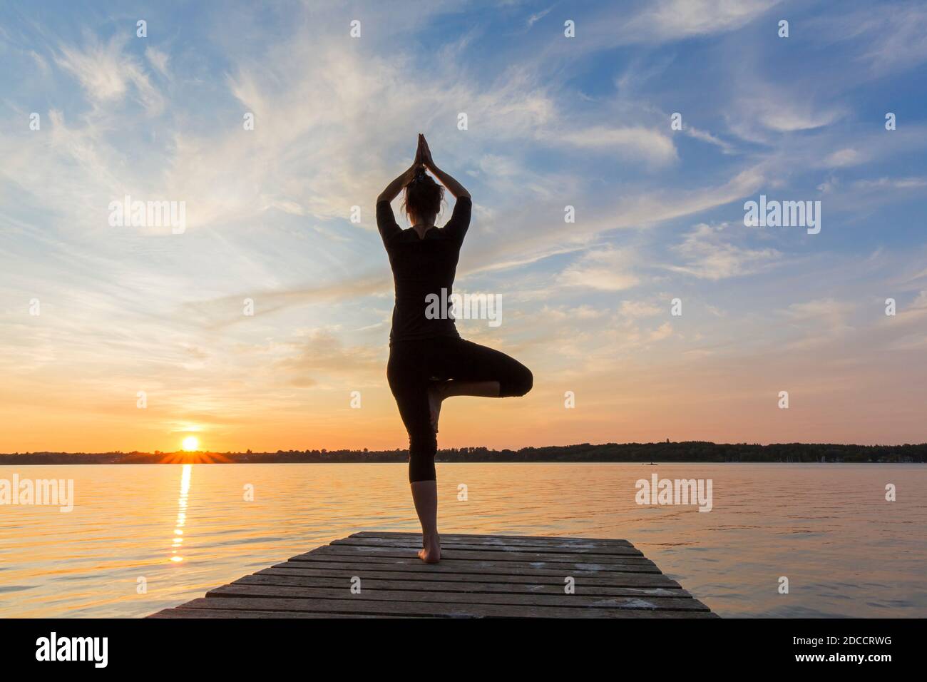 Woman Practicing Standing Posture Vrikshasana Tree Pose One Legged Woman Practicing Standing Posture Vrikshasana Tree Pose One Legged