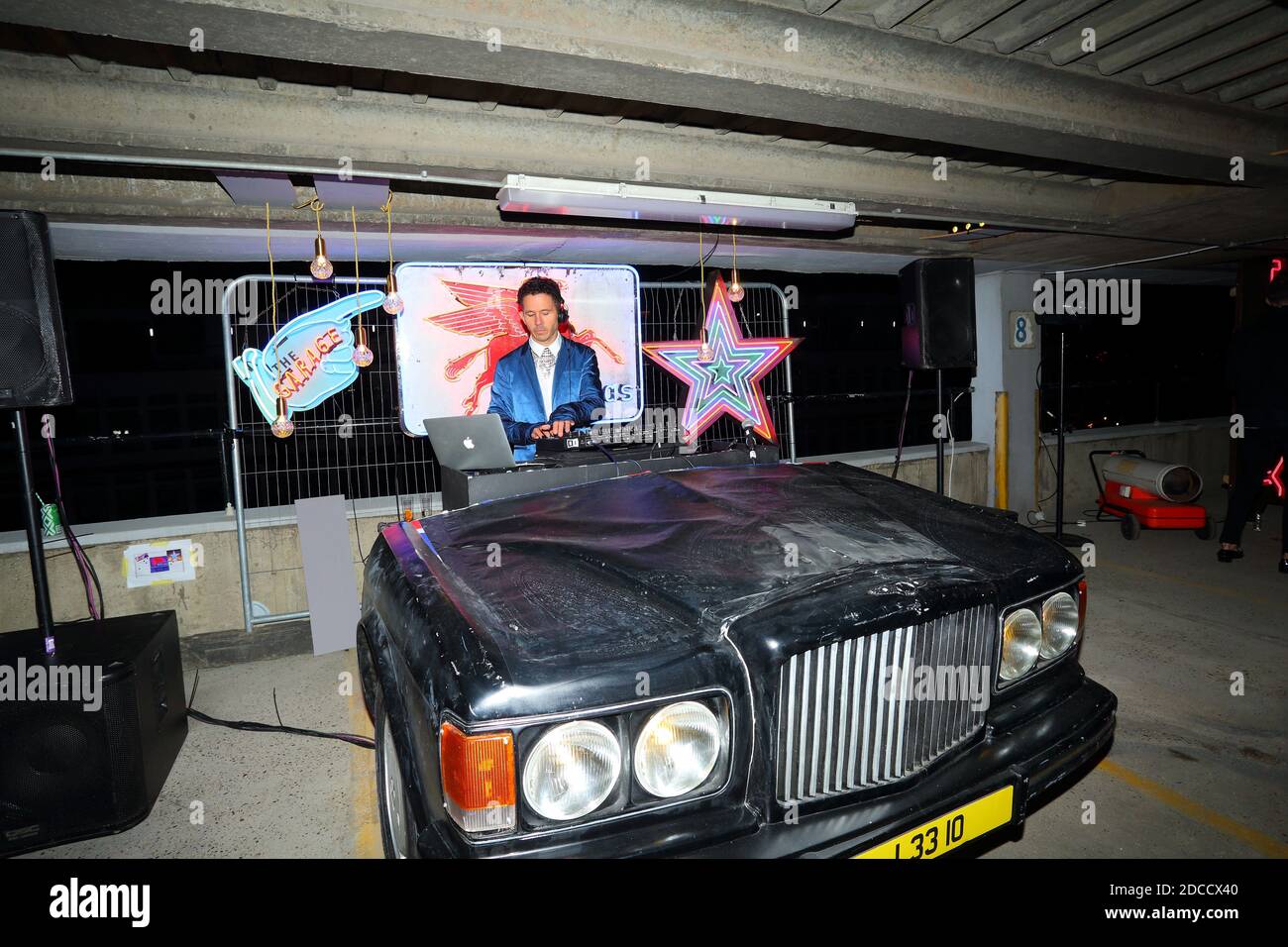 Great Britain / England /London / Dj playing music out of Bentley at Shoreditch Party Stock Photo