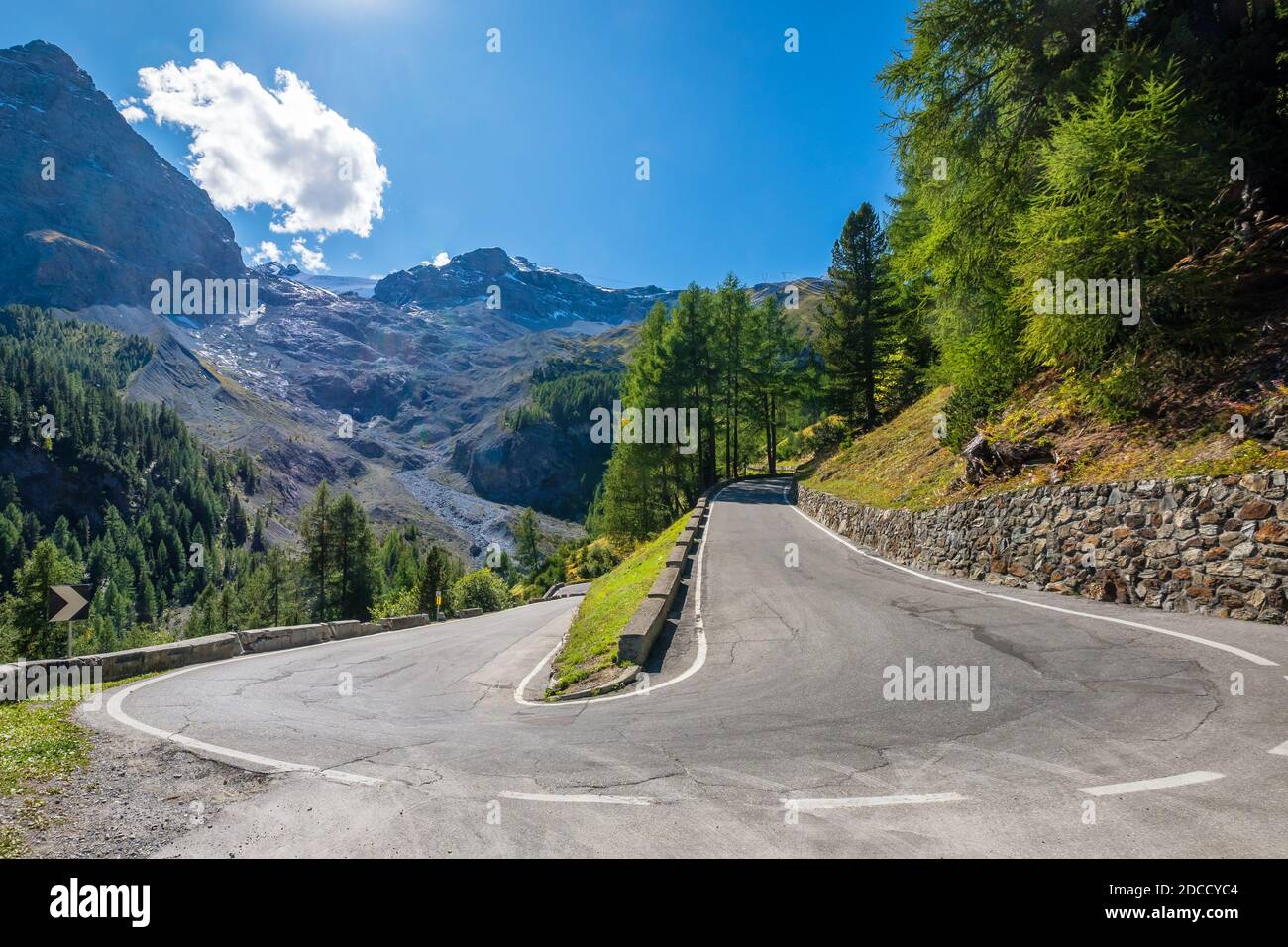 The Stelvio Pass is a mountain pass in the Ortler alps in South Tyrol and connects to the Swiss Umbrail pass towards the valley Val Müstair Stock Photo