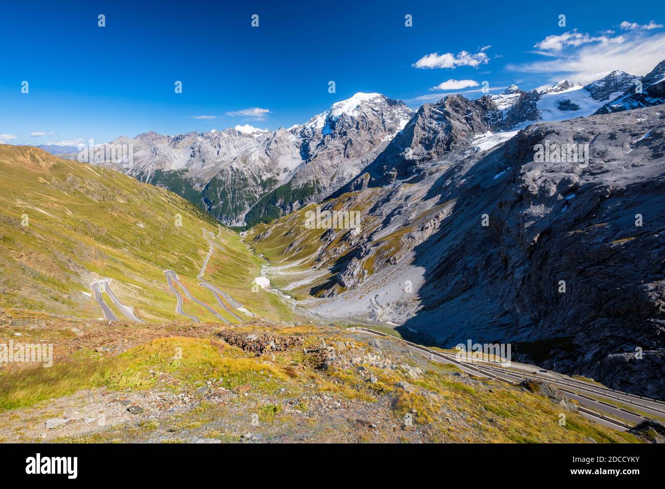 The Stelvio Pass is a mountain pass in the Ortler alps in South Tyrol and connects to the Swiss Umbrail pass towards the valley Val Müstair Stock Photo