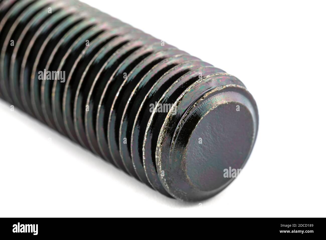 A background made of a macro shot of a black HF bolt thread with a hardness of 4.8, isolated on a white background. Stock Photo