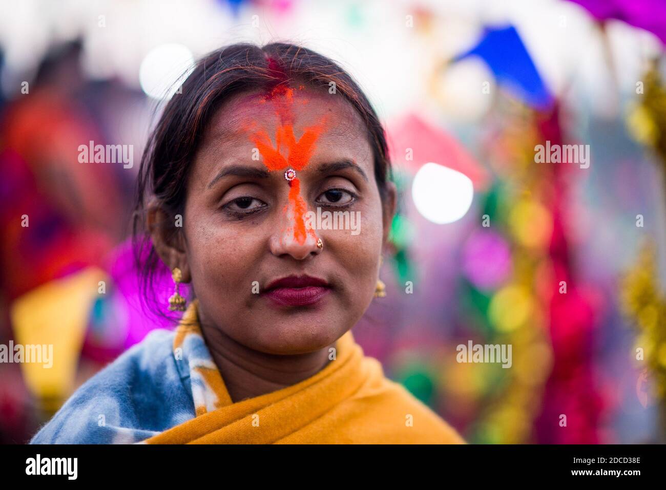A woman with vermilion in her face during the celebration. The Chhath  festival is celebrated to worship Sun God where devotees pay homage to the  sun and his sister 'Chhathi Maiya'. The