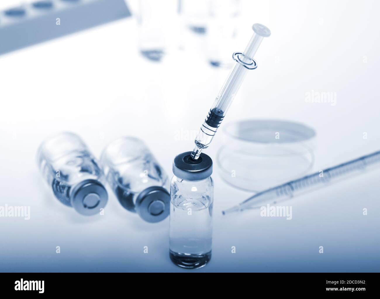 Test-tubes with on a white and blue background. Laboratory glassware ...