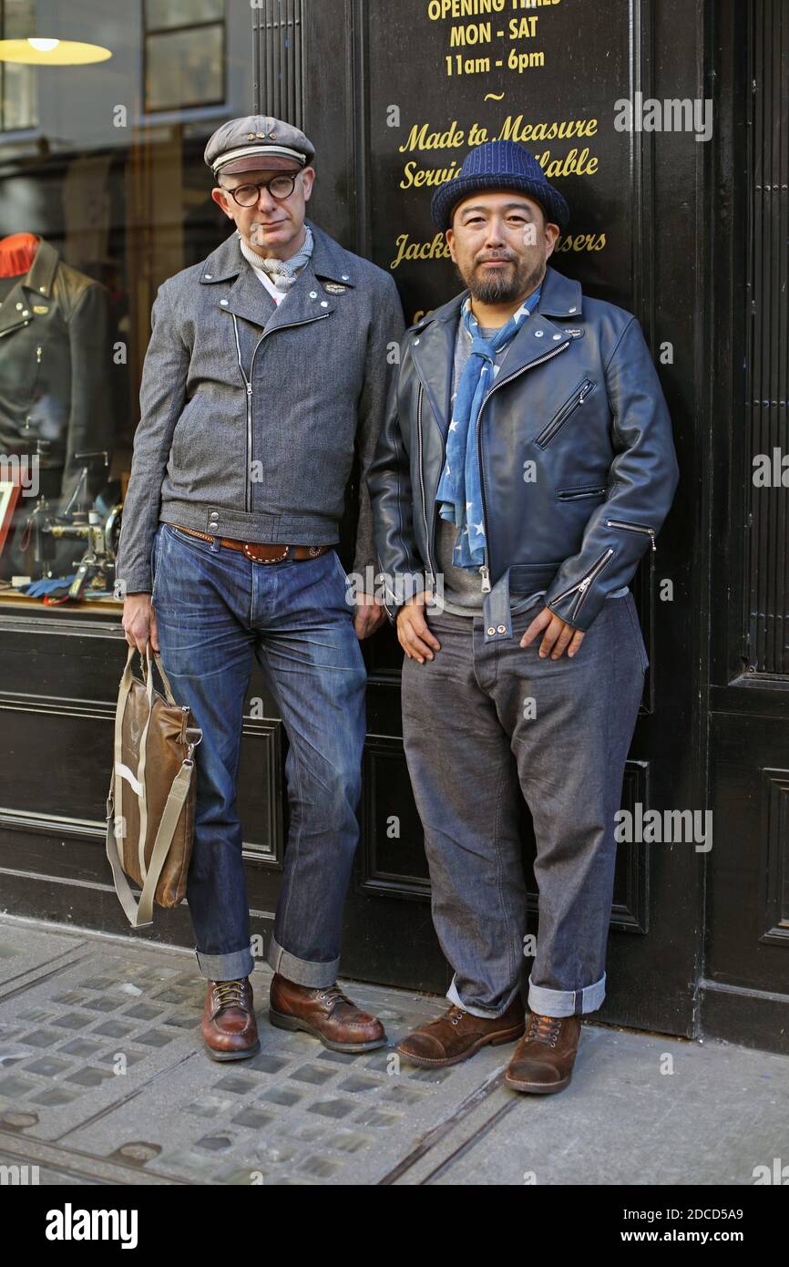 United Kingdom / London / Two man dressed in denim standing in front of shop . Stock Photo