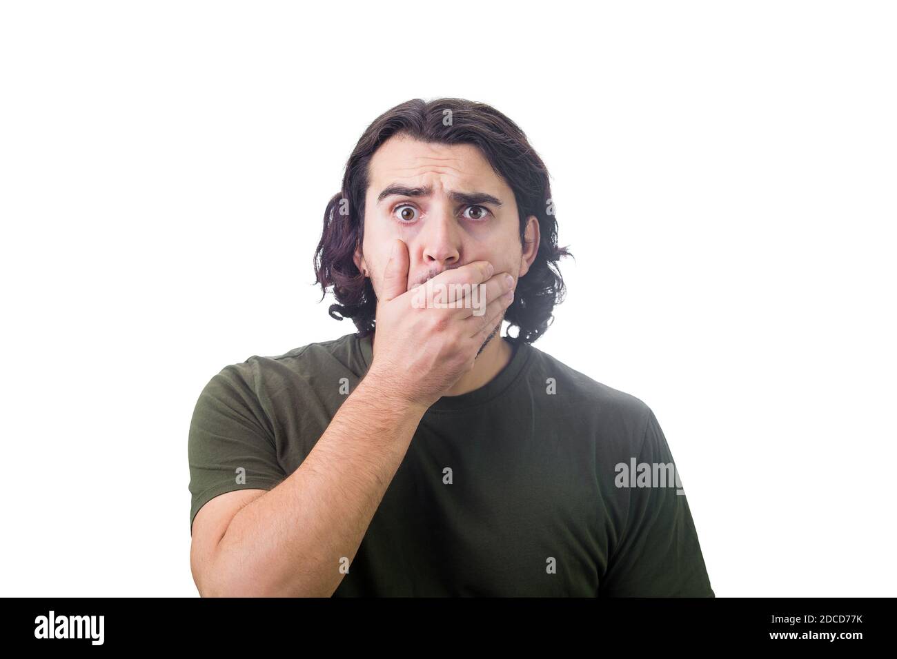 Portrait of shocked young man, long curly hair style, staring to camera  with big eyes, covers his mouth with hand, isolated on white background.  Amaze Stock Photo - Alamy