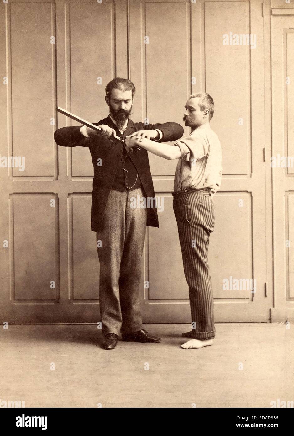 Alphonse Bertillon Measuring Prisoner, 1893 Stock Photo