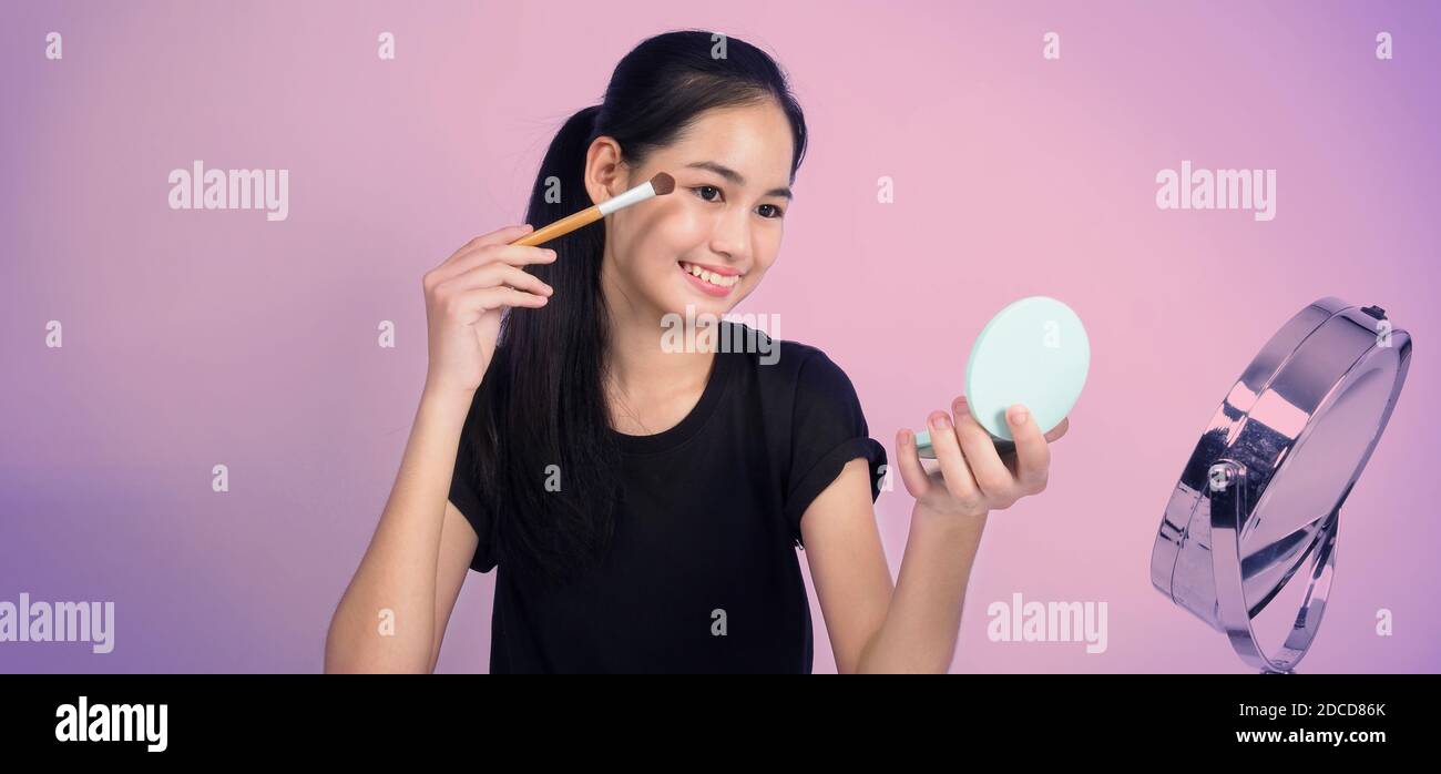 Asian Teen Woman Sit In Front Of Camera And Live Broadcasting As A Beauty Blogger Influencer Or Youtuber To Review Or Advice About How To Make Up At H Stock Photo Asian Teen Woman Sit In Front Of Camera And Live Broadcasting As A Beauty Blogger Influencer Or Youtuber To Review Or Advice About How To Make Up At H Stock Photo