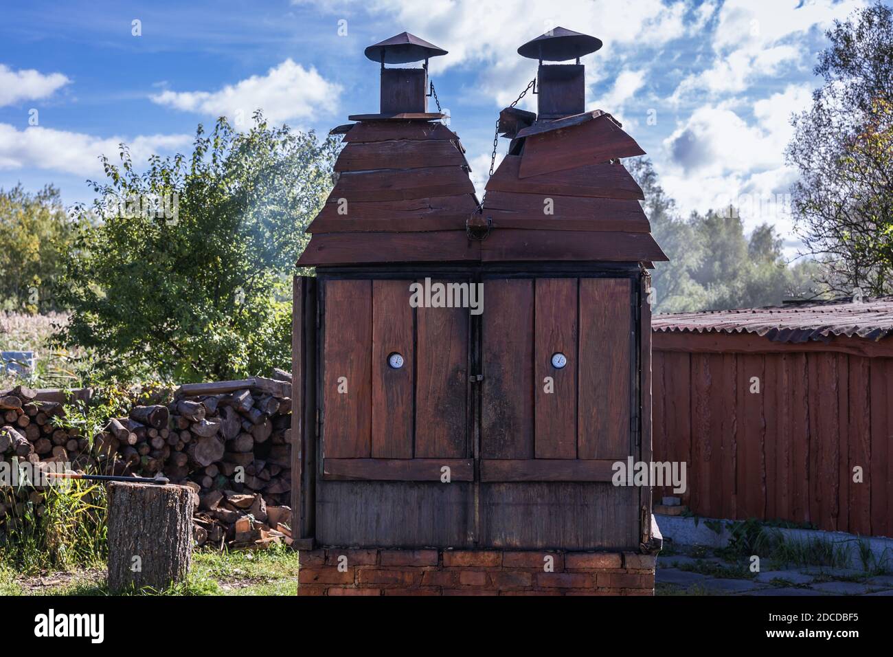 Small wooden smoker in front of fish shop port in Katy Rybackie village over Bay of Vistula, Pomeranian Voivodeship, in northern Poland Stock Photo