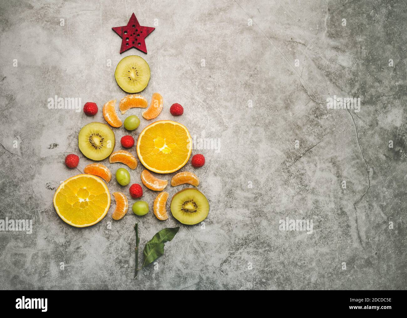 Christmas concept background. Pieces of fruit in the form of a