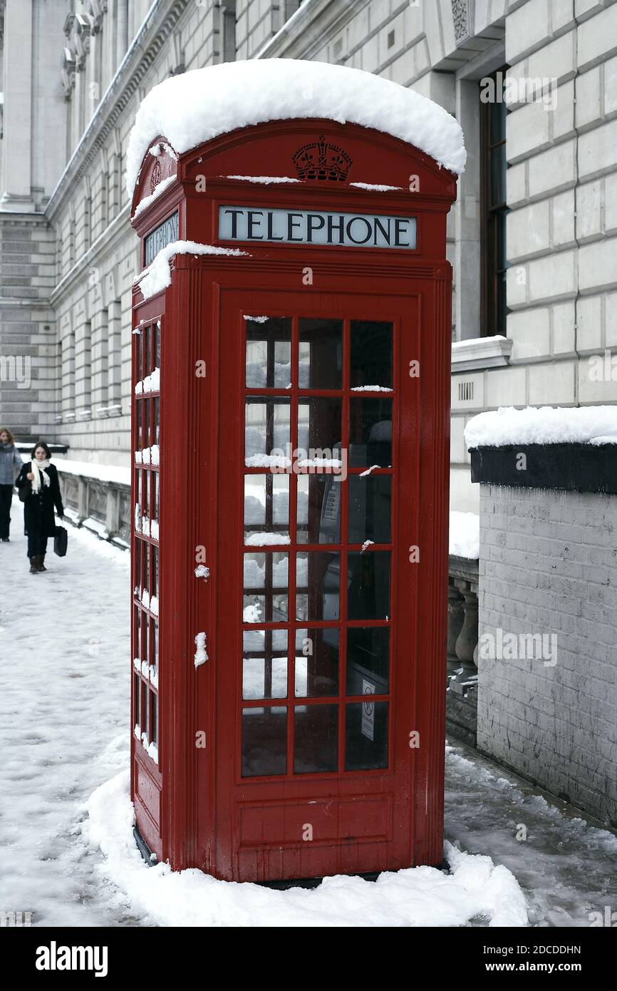 GREAT BRITAIN /England / London /A view of phone boxes near Houses of Parliament after heavy snow falls across London and the United Kingdom. Stock Photo