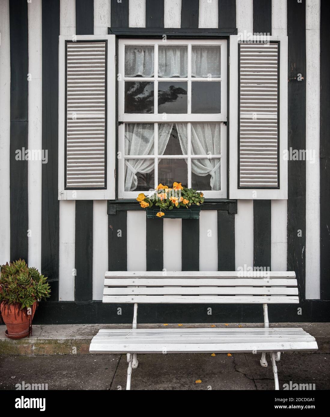 Tradittional fishermen's colorful houses in Costa Nova, Aveiro, Portugal. Tourism atraction. Black stripes. Detail of window. Stock Photo