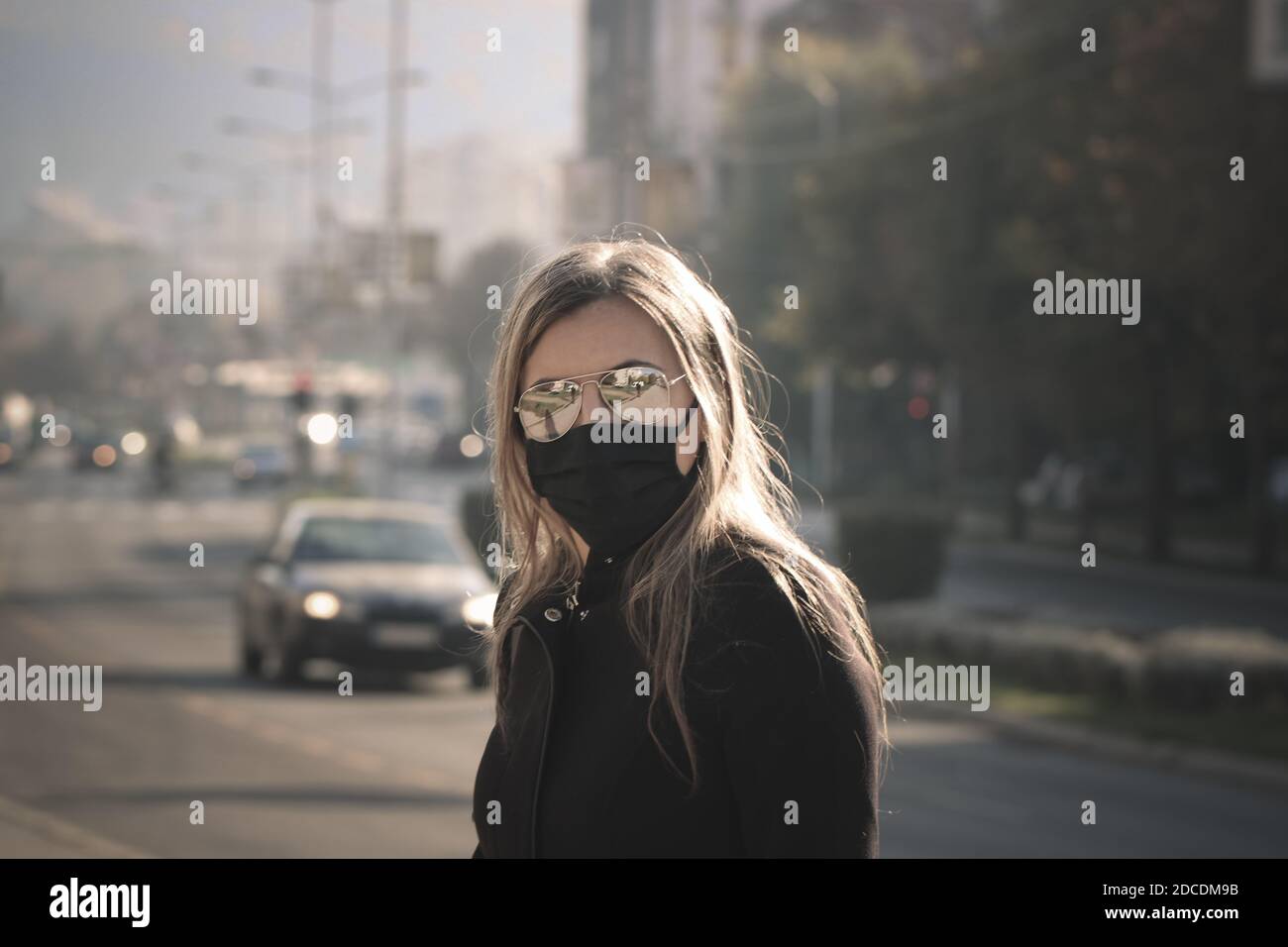 Alone woman in corona and pollution time Stock Photo