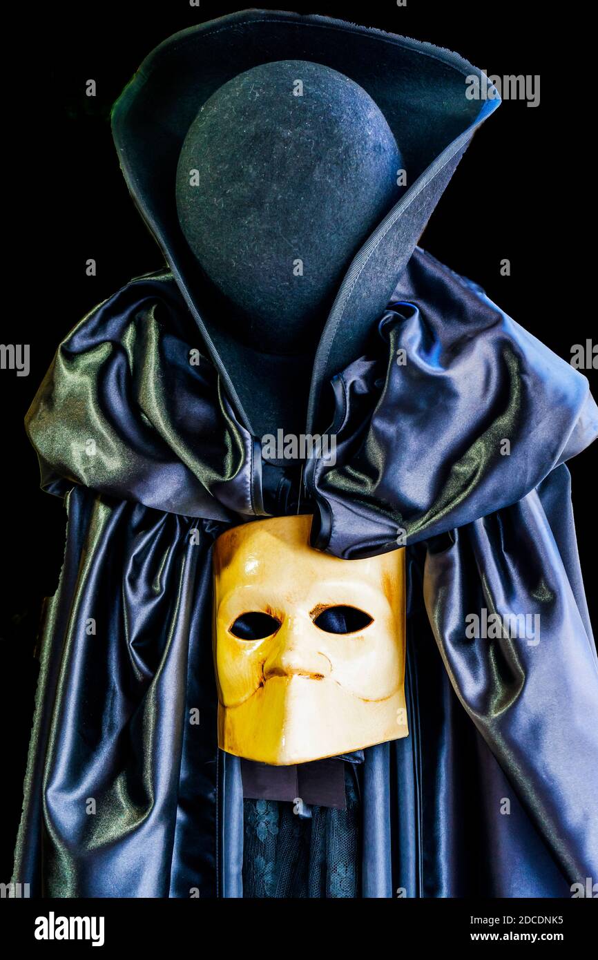 Traditional Venetian Mask Black Cape Hat Venice Italy Used since the 1200s for Carnival. Masks allowed the Venetians to do what was illegal Stock Photo