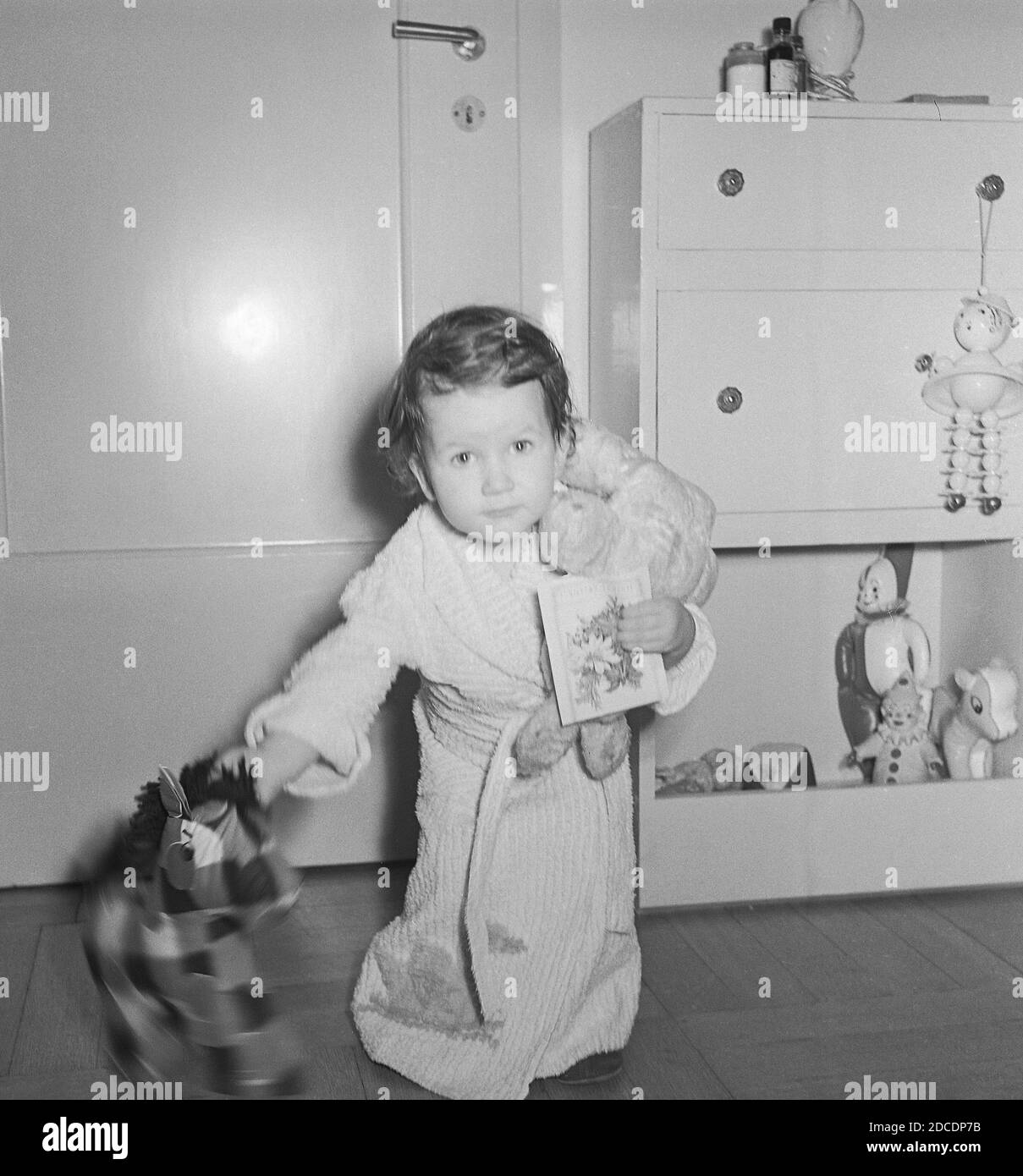 1950s baby girl plays with stuffed animals in her room, USA Stock Photo