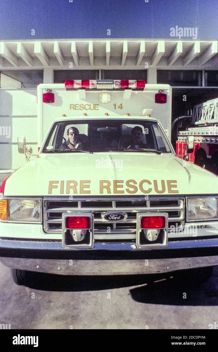 EMT vehicle parked in front of the fire station in Tampa, Florida  1980s Stock Photo