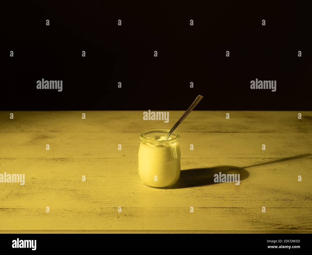 jar of yogurt and a teaspoon Stock Photo Alamy