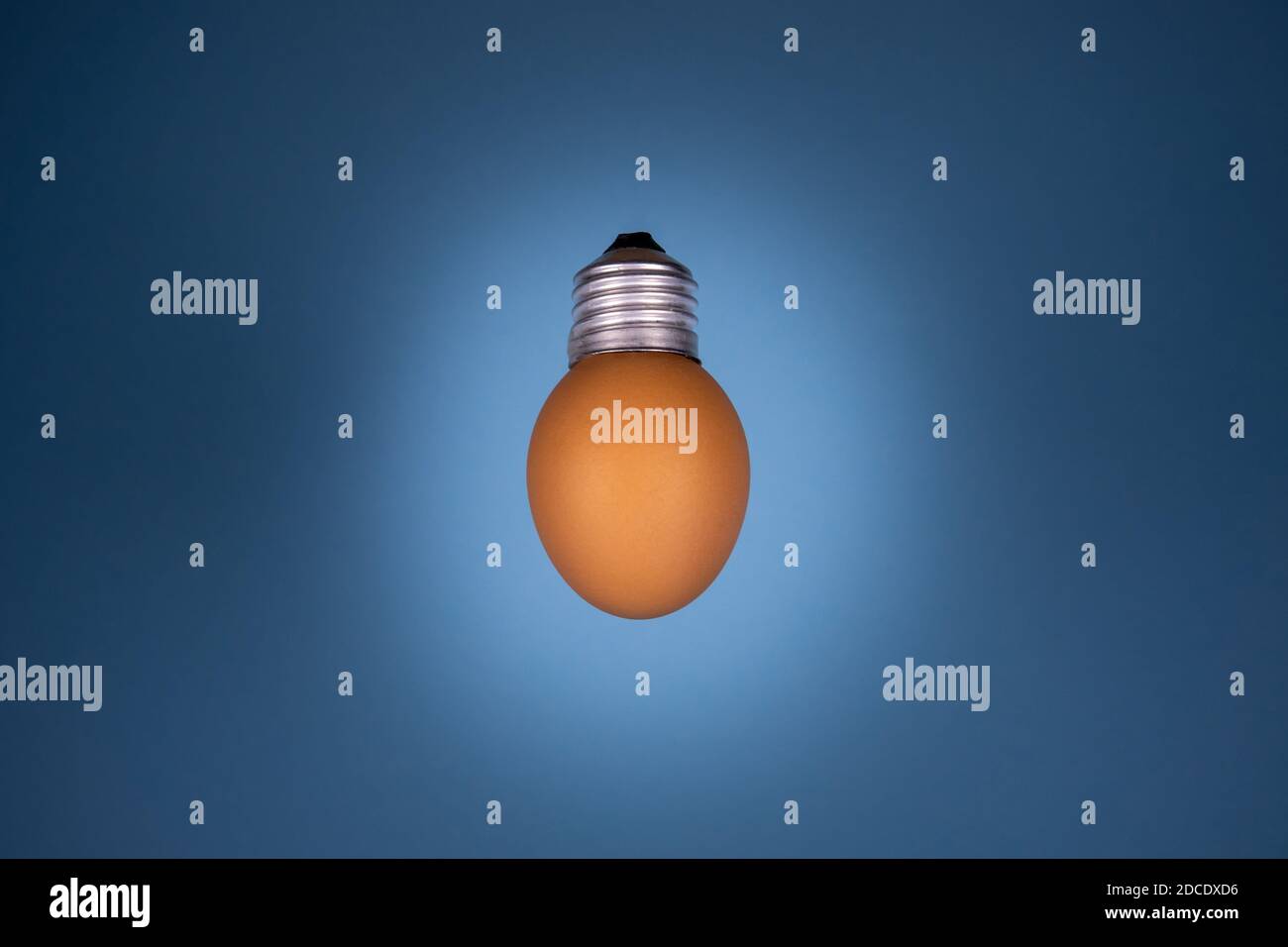 Egg lightbulb on deep black background. Creative idea concept Stock Photo