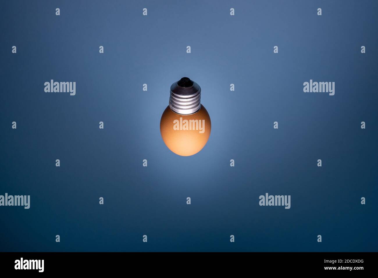 Egg lightbulb on deep black background. Creative idea concept Stock Photo