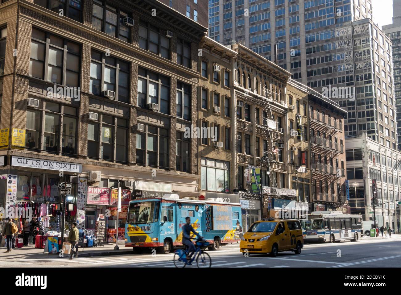 Business facades along Sixth Avenue in the garment district, Manhattan, NYC, USA Stock Photo