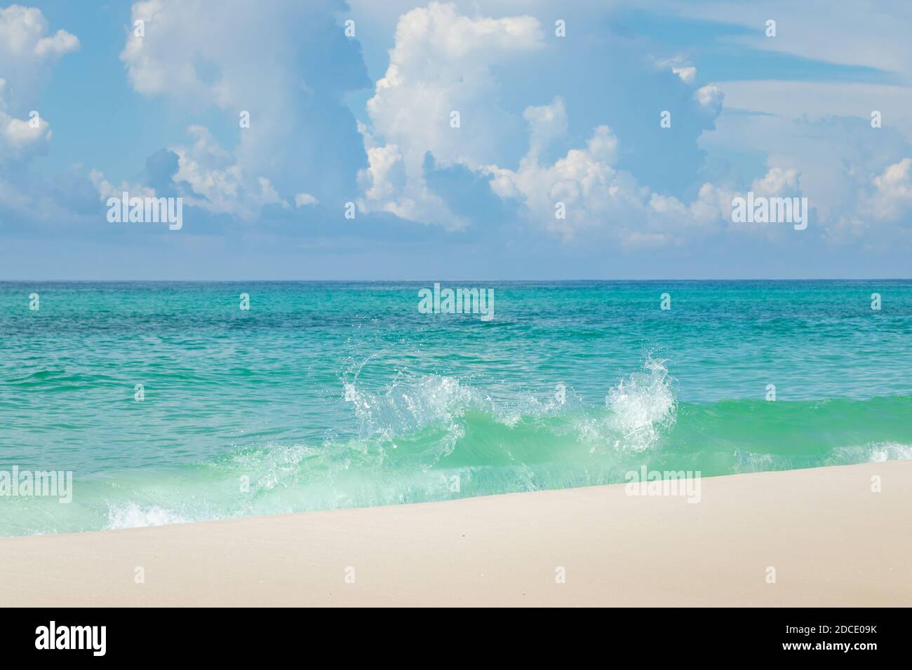 waves crashing in blue green sea at beach at Biloxi Mississippi USA Stock Photo