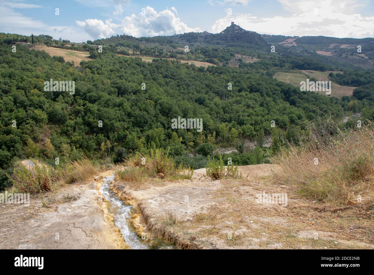 The spring of thermal hot water in the countryside of Bagno Vignoni in Tuscany, Siena province, Italy Stock Photo