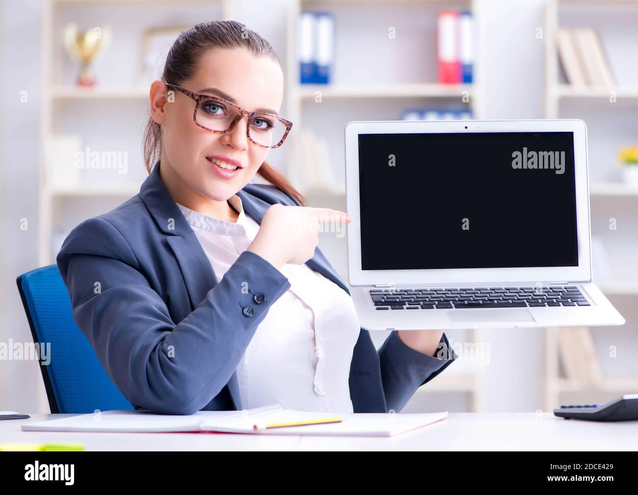 The businesswoman working in the office at desk Stock Photo - Alamy