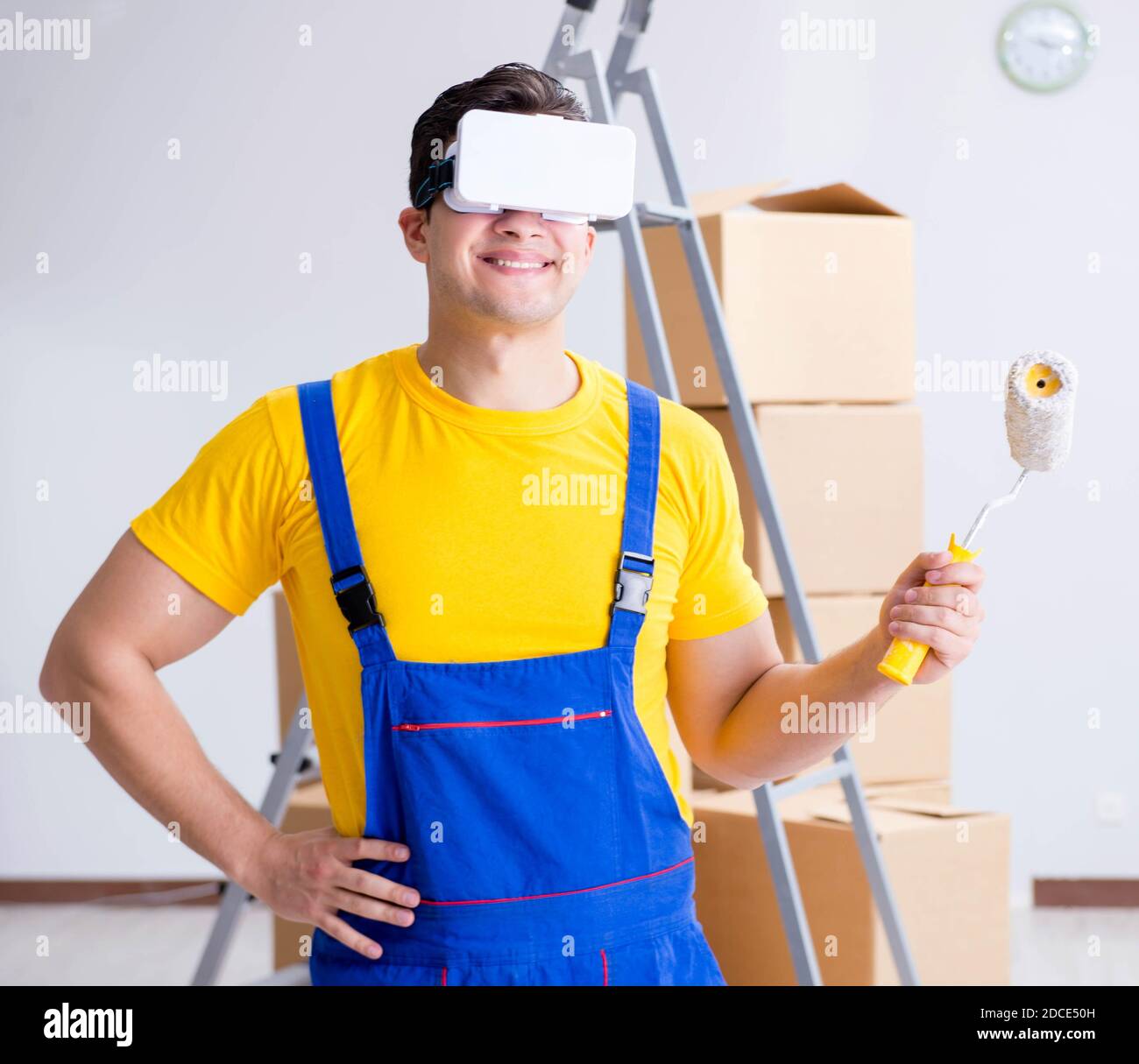 The painter contractor working with virtual reality goggles Stock Photo