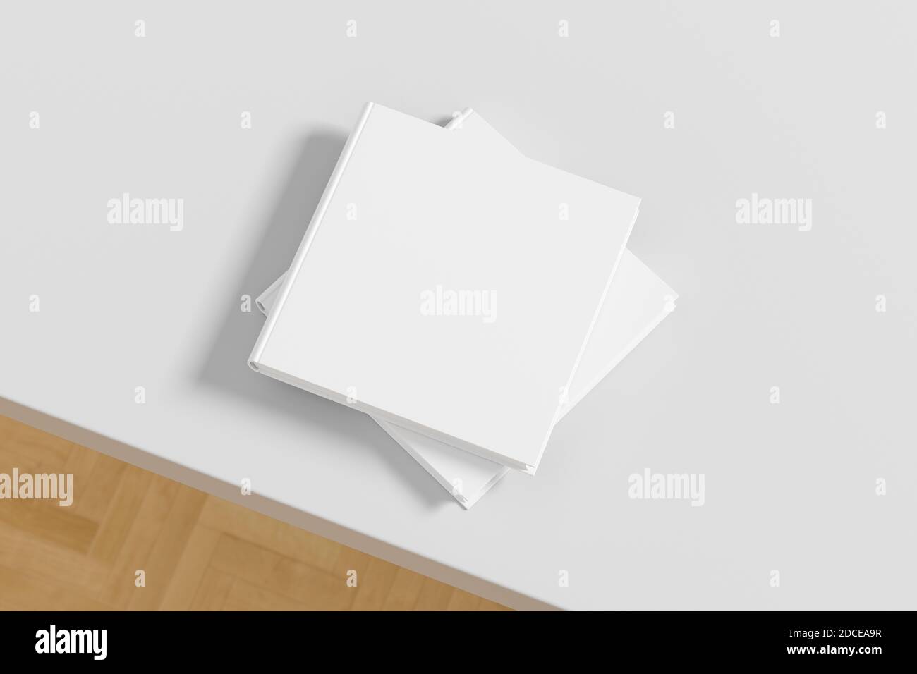 Square white hardcover book stack mockup on the white table Stock Photo