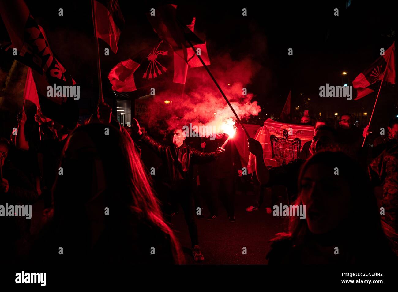 Madrid, Spain. 20th Nov, 2020. Far right wing supporter making a fascist salute carrying a flare during a rally to commemorate the death anniversary of Falange founder Jose Antonio Primo de Rivera. Credit: Marcos del Mazo/Alamy Live News Stock Photo