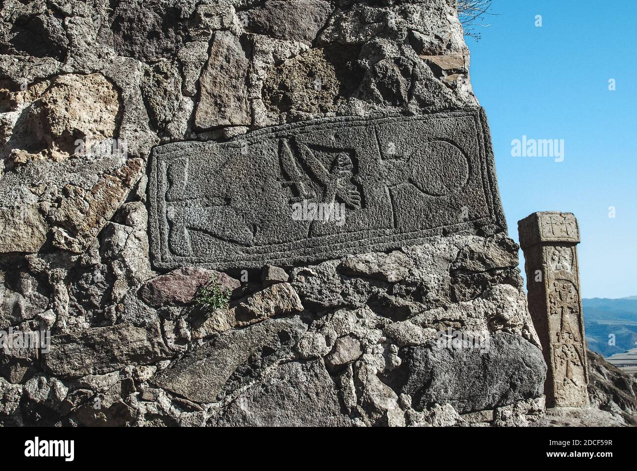 Detail of antique Armenian church architecture. Grave (probably knight's) in the wall. Stock Photo