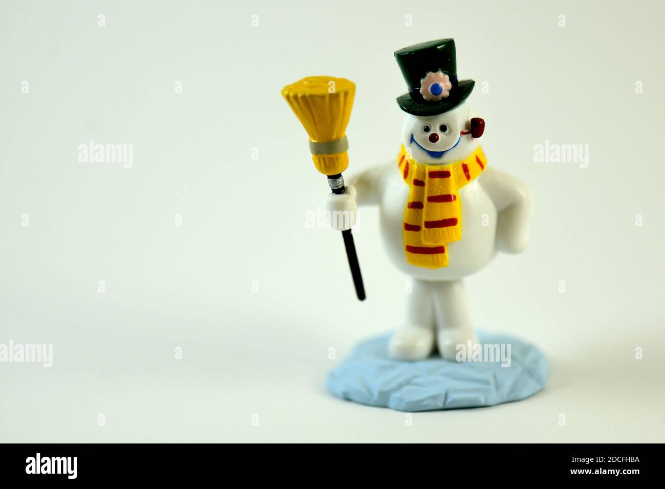 Snowman with a Hat and Broom Stock Photo