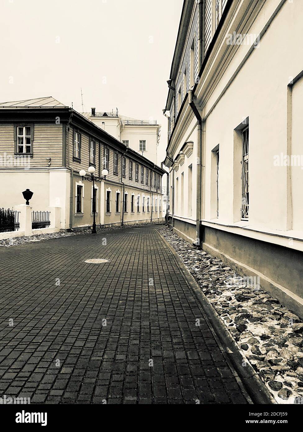 Pedestrian road leading between ancient buildings Stock Photo - Alamy