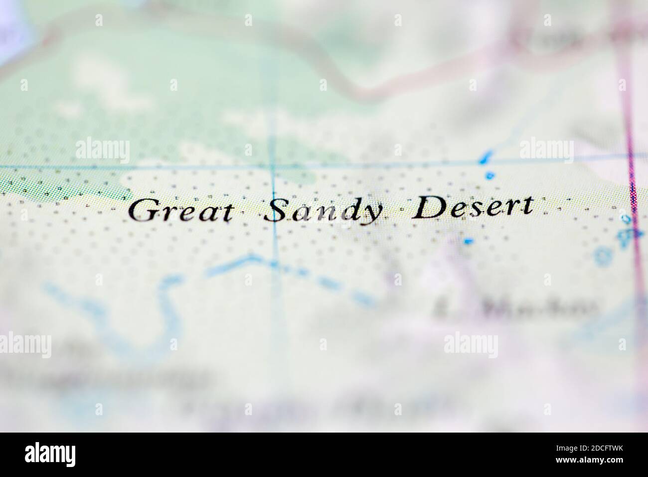 Shallow depth of field focus on geographical map location of Great Sandy Desert Australia Oceania continent on atlas Stock Photo