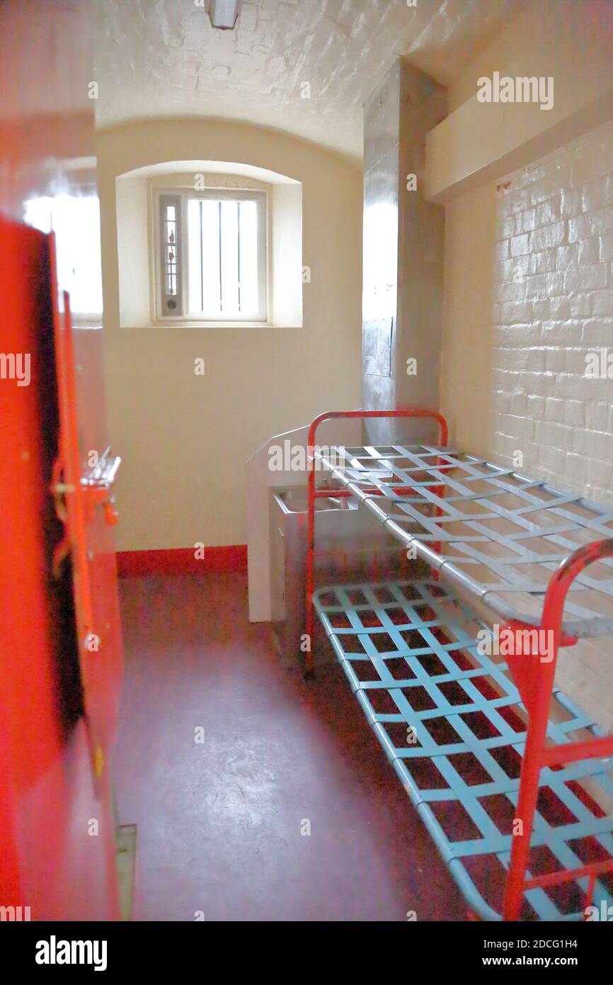 View of a small prison cell inside infamous Reading Prison where Oscar Wilde was incarcerated, Reading, Berkshire, UK Stock Photo