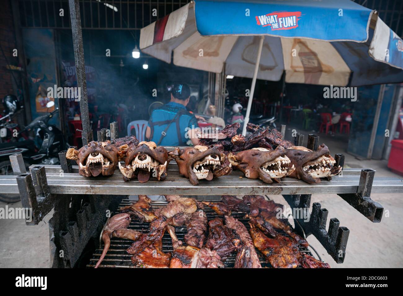 Svay Rieng, Cambodia. 14th June, 2020. Dog meat is seen displayed on a grill for sale at a restaurant.An estimated 800 people a year die of rabies in Cambodia, one of the highest deaths rates per capita in the world. At the root of Cambodia's endemic are unvaccinated dogs, in a country with one of the highest dog to human ratios in the world. Efforts at achieving herd immunity are significantly disrupted by the 3 million dogs per year slaughtered for Cambodia's dog meat trade. Some experts have warned that unless the dog meat trade is addressed, rabies will still remain prevalent. (Credit I Stock Photo