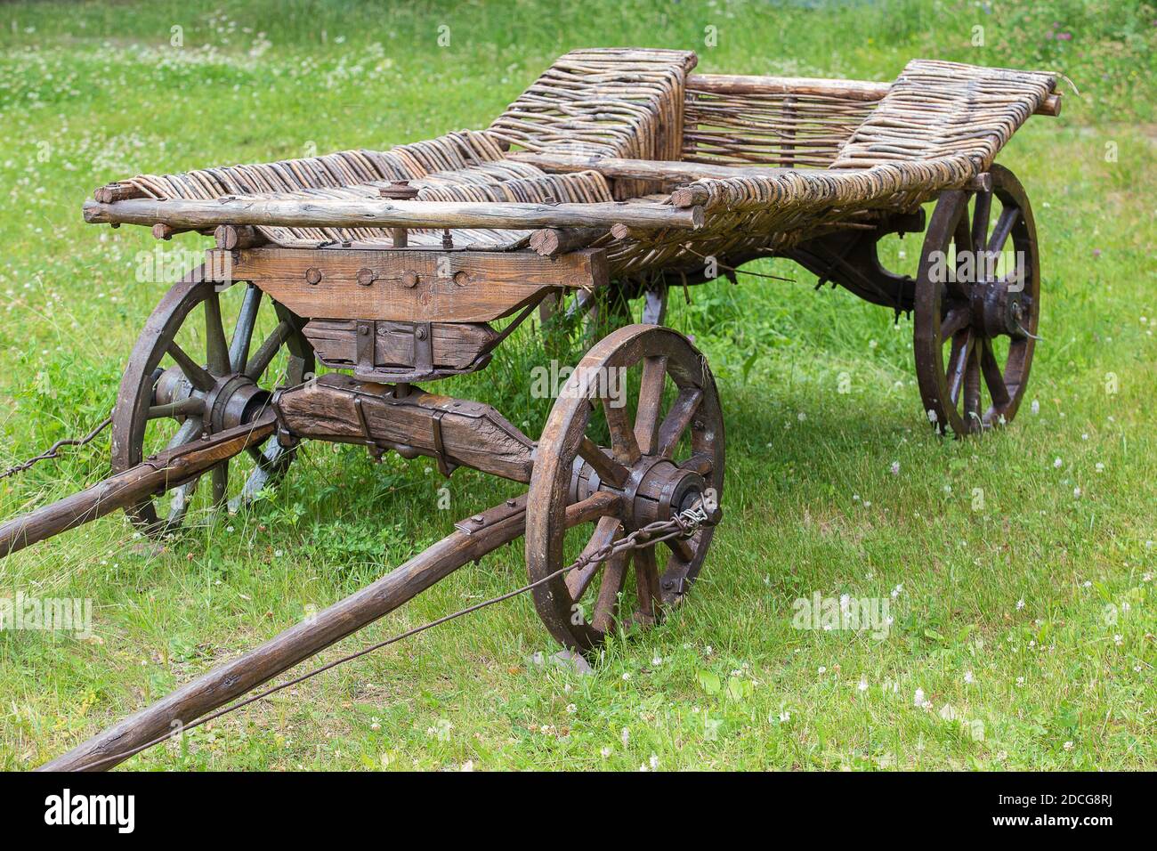 ancient wooden cart on meadow in summer Stock Photo - Alamy