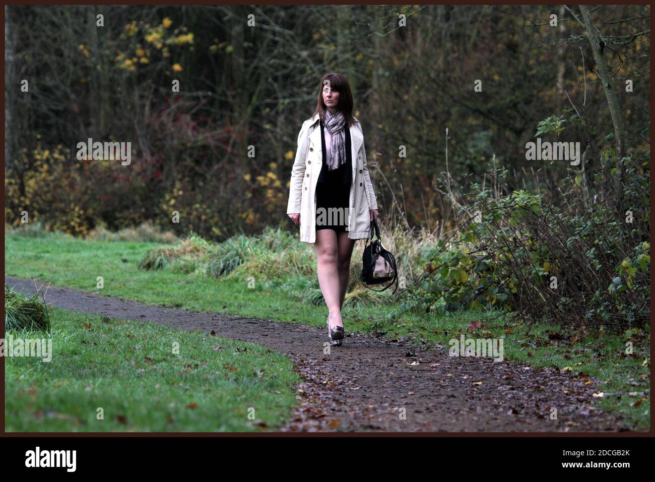 Woman in short skirt walking hi-res stock photography and images - Alamy