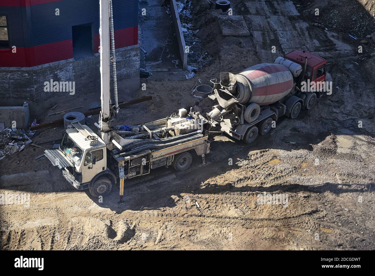 Heavy concrete mixer and concrete pump are waiting for their work on the site. delivery of