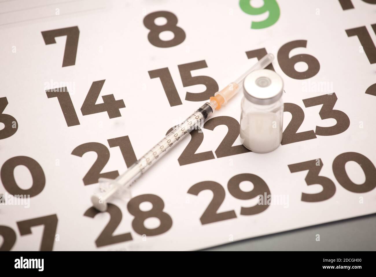 Syringe with vaccine bottle with calendar (2021 Stock Photo Alamy Syringe with vaccine bottle with calendar (2021 Stock Photo Alamy