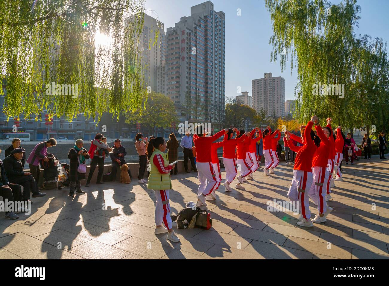 Locals dancing in the park and City wall of Xi'an, Shaanxi Province, People's Republic of China, Asia Stock Photo